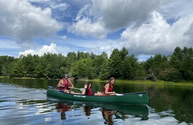 students canoeing during outdoor adventure