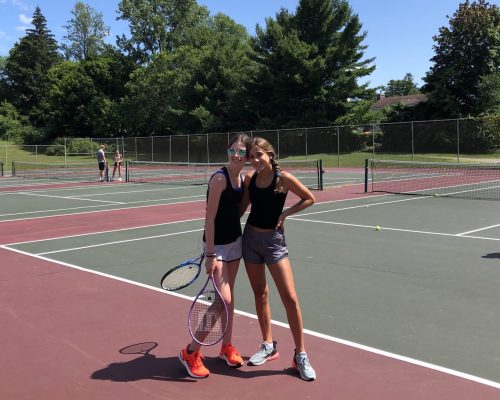 girls playing tennis