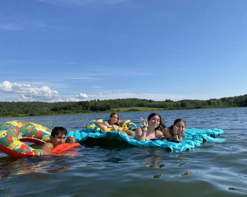 students enjoying the lake