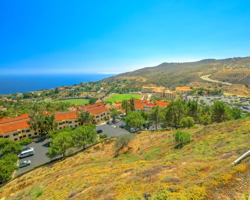 Scenic landscape of Pacific Coast in California. Panoramic aerial view of Pepperdine University, an American university in Malibu, Unites States. The campus on the hills overlooking the Pacific Ocean.
