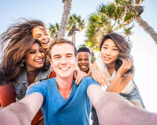 Students on Beach with Palm Trees