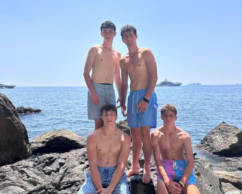 amalfi coast boys on rock