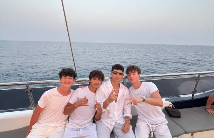 boys on catamaran barcelona