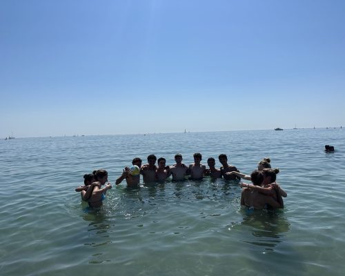 group in water barcelona beach