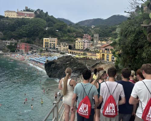 group walking beach italy