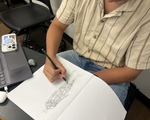 student sketching fashion 2