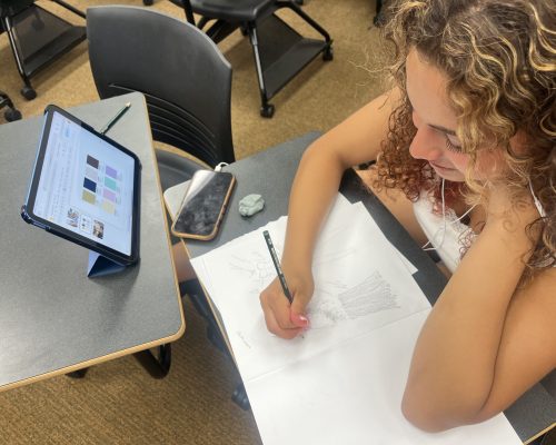 student sketching fashion